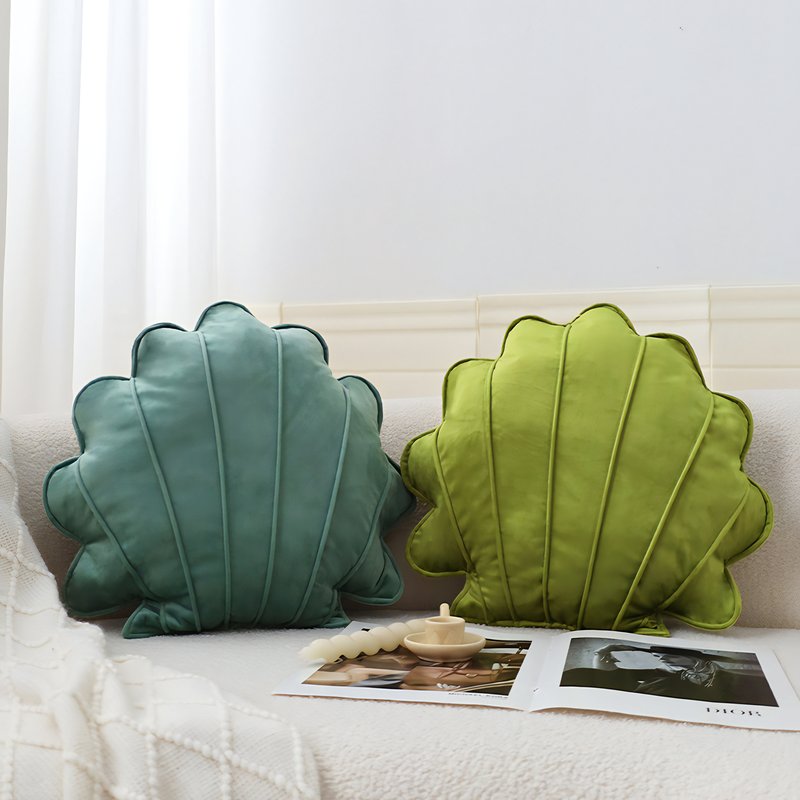 Coussins en forme de coquillage vert et bleu