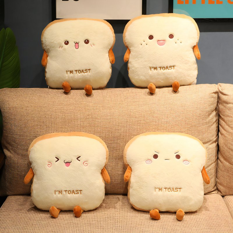 Coussins kawaii posés sur un canapé avec des visages qui expriment différentes émotions